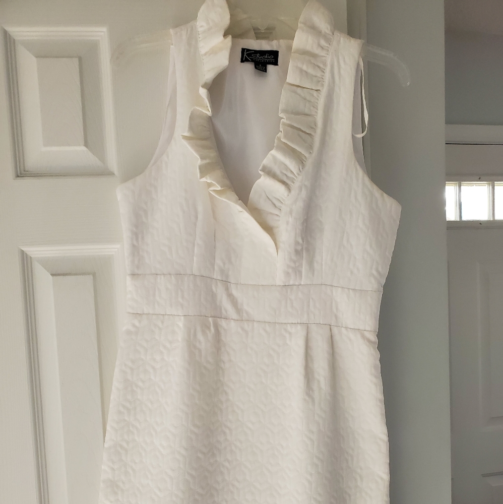 A white sleeveless dress.